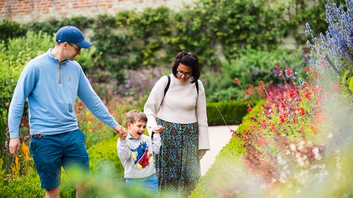 Families exploring the garden at Wimpole Estate, Cambridgeshire